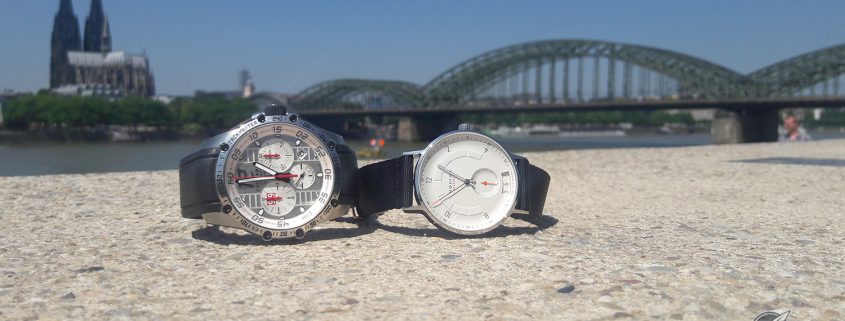 The Chopard Superfast Chrono Porsche 919 Edition and the Nomos Glashütte Autobahn with the Cologne’s cathedral and the Deutz bridge in the background