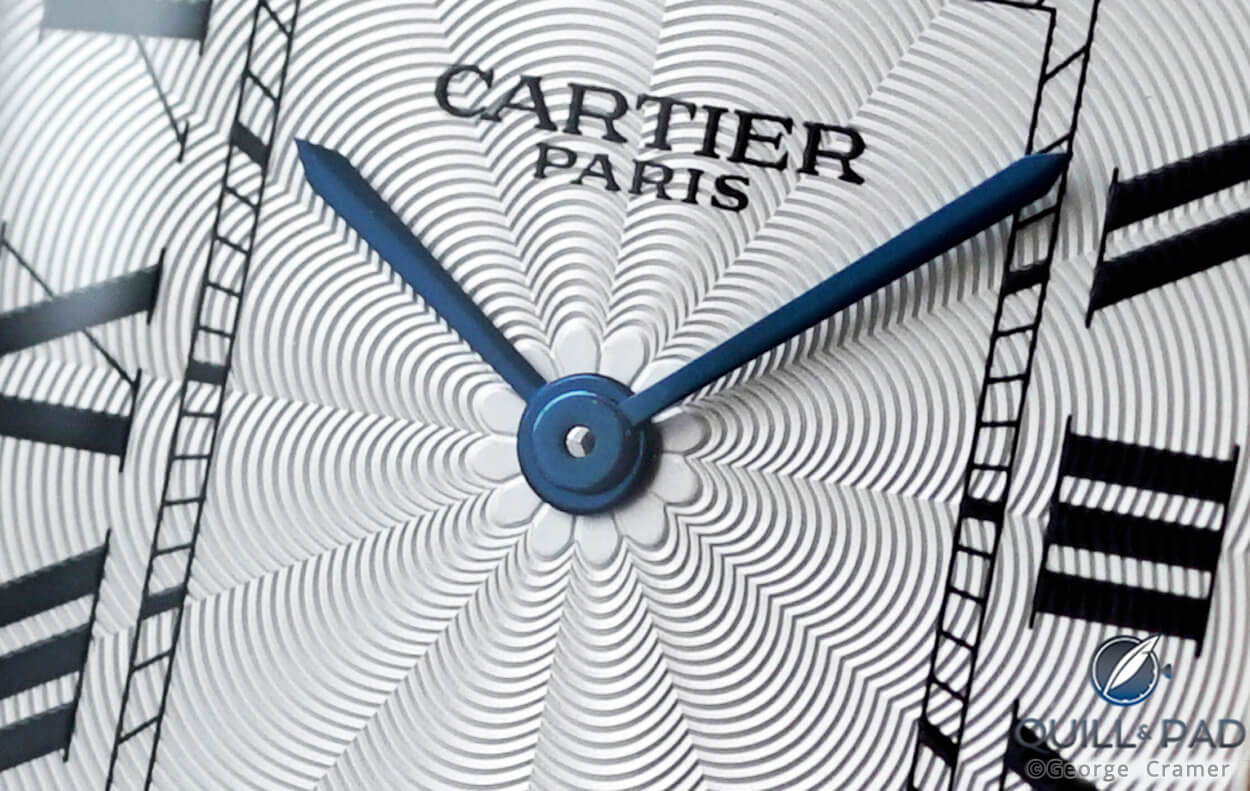 Close look at the guilloche “flower rosette” stamping reminiscent of the 1920s on the dial of a Col-lection Privée Cartier Paris model