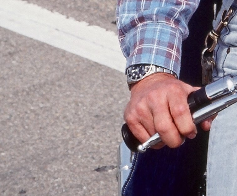 Crop from a photo featured in Barbara Minty McQueen’s book ‘The Last Mile’ showing Steve McQueen’s Rolex Reference 5513-clad wrist (photo courtesy Barbara Minty McQueen)