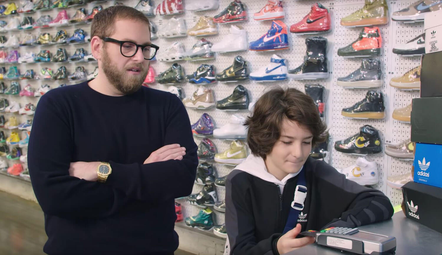 Jonah Hill hill wearing a Patek Phillipe Nautilus Reference 3800/1J in yellow gold while promoting his film Mid90s with Sunny Suljic