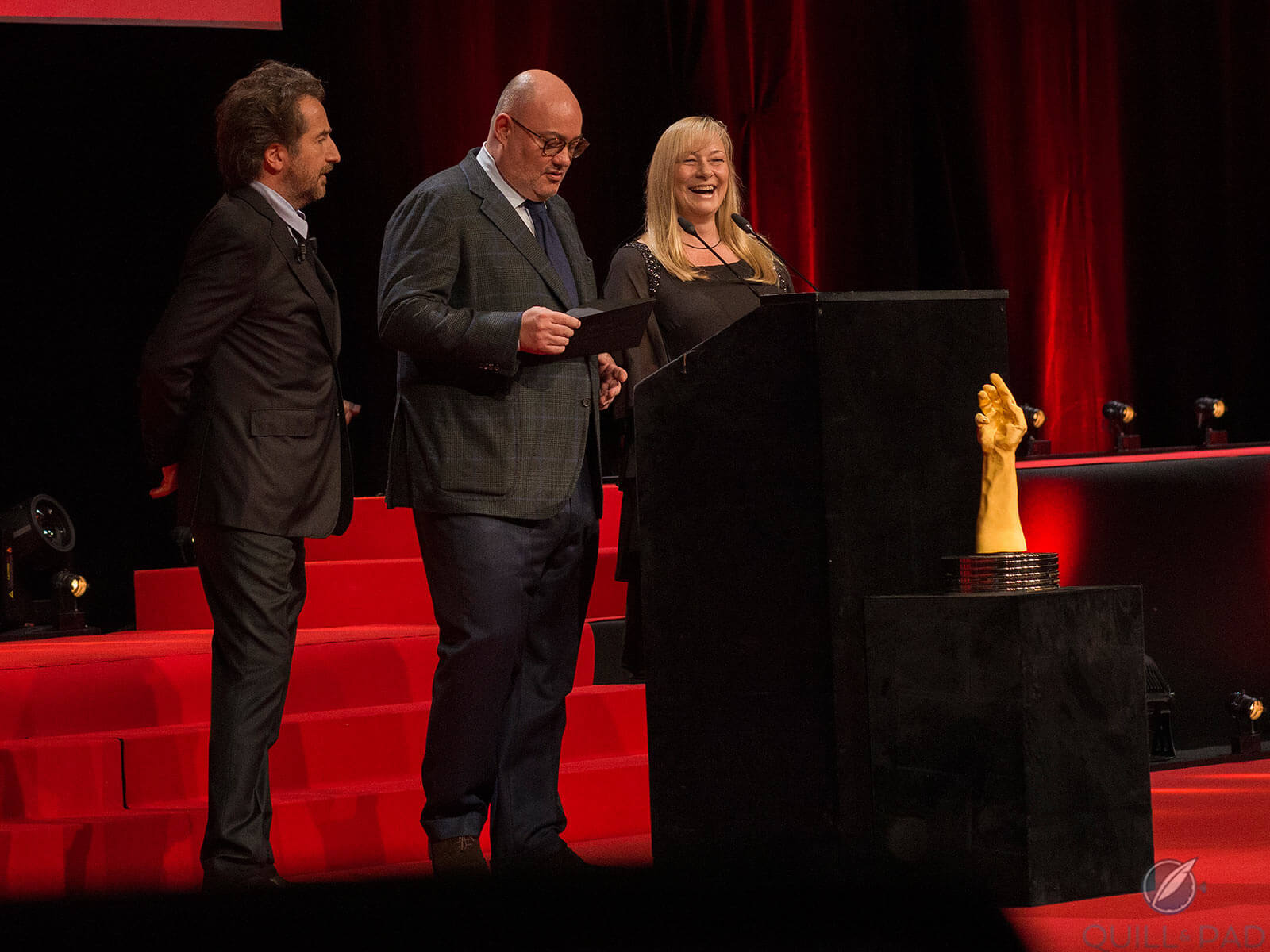 Elizabeth Doerr (right) and William Rohr (center) having fun at GPHG as host Edouard Baer looks on