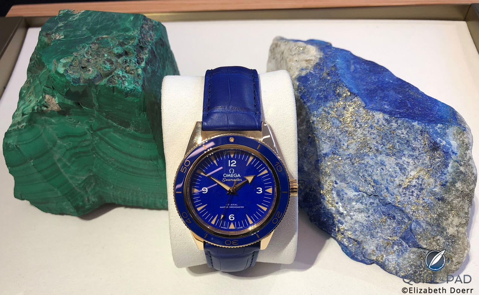 A 2019 Omega Seamaster between malachite (left) and lapis lazuli